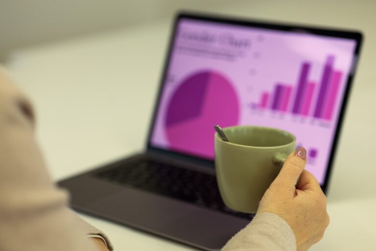 Laptop displaying charts and analytics used to evaluate AI search visibility performance