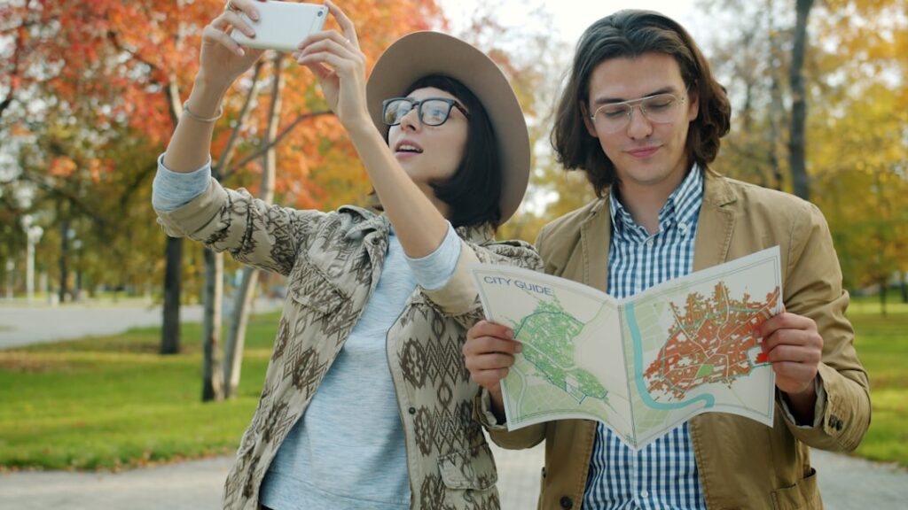 People using a city map and smartphone, representing local search, maps and customer discovery